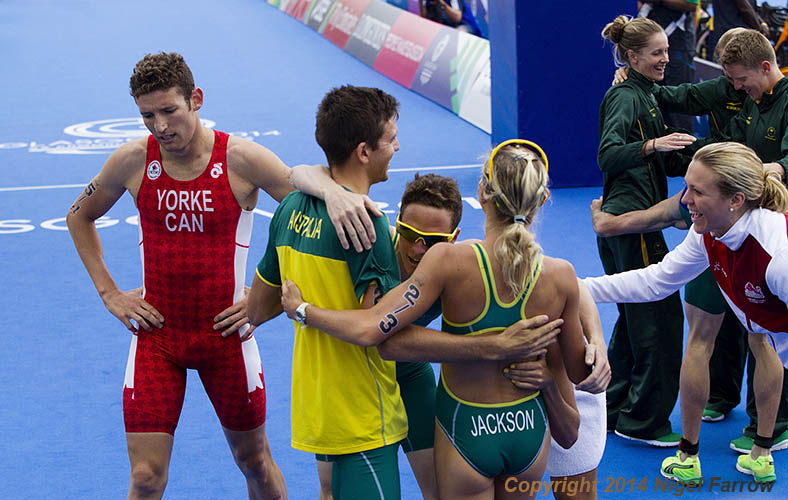 TRIATHLON-Canada's Andrew Yorke (left) recovers after finishing fourth for the second time at the 2014 Commonwealth Games triathlons in Glasgow, Scotland